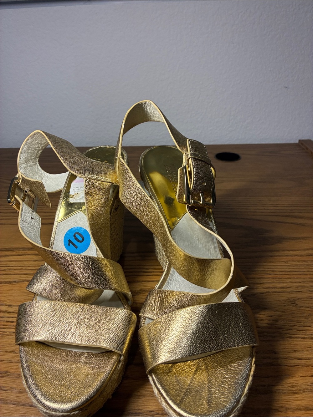 Michael Kors gold sandals, with straw heels.